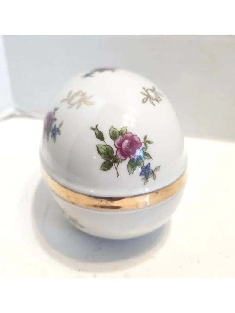 Hand-Painted Porcelain Egg-Shaped Trinket Box With Gold Accents & Floral Design